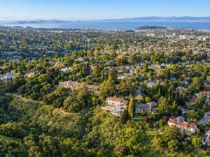 Aerial view of a Burlingame, California hillside neighborhood above San Francisco Bay